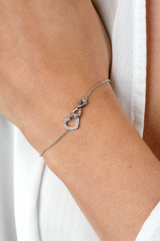 ZINZI Silberarmband mit Infinity-Symbol, verbunden mit einem offenen Herzen, besetzt mit weißen Zirkonia, 17-19 cm ZIA2596